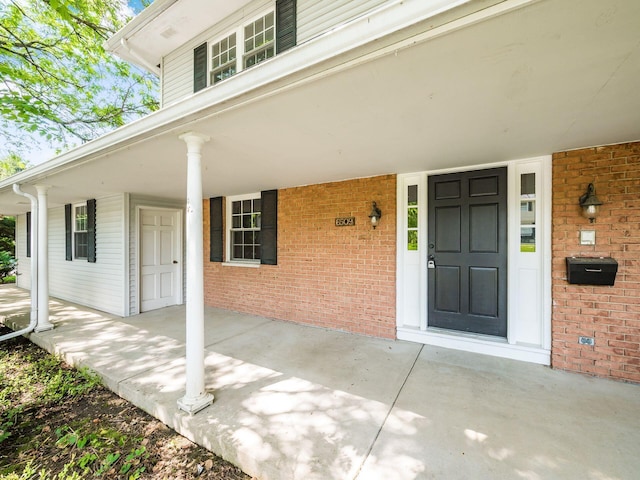 6509 Evening St, Worthington, OH 43085 - entrance to property with covered porch and brick siding