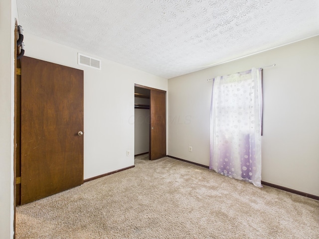 6343 Birchview Dr S Unit 6343-6345, Reynoldsburg, OH 43068 - unfurnished bedroom with carpet flooring, a closet, and a textured ceiling