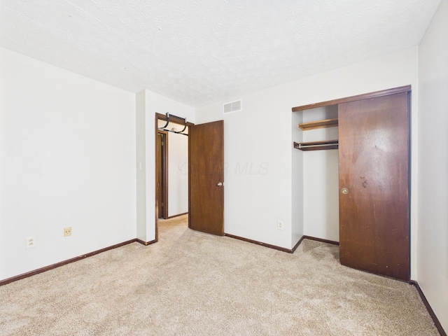 6343 Birchview Dr S Unit 6343-6345, Reynoldsburg, OH 43068 - unfurnished bedroom with light colored carpet, a textured ceiling, and a closet