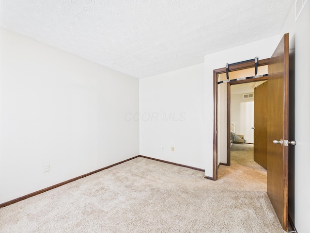 6343 Birchview Dr S Unit 6343-6345, Reynoldsburg, OH 43068 - unfurnished room with carpet floors and a textured ceiling