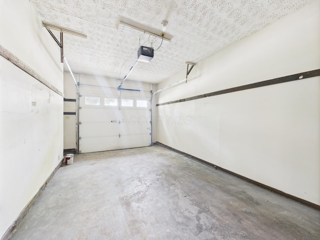 6343 Birchview Dr S Unit 6343-6345, Reynoldsburg, OH 43068 - garage with a garage door opener and baseboards