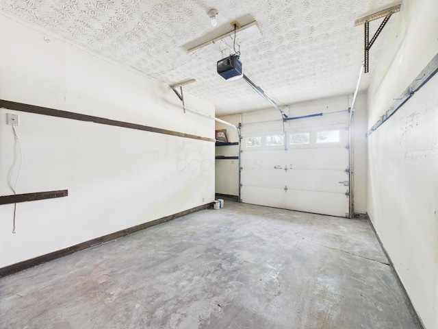 6343 Birchview Dr S Unit 6343-6345, Reynoldsburg, OH 43068 - garage featuring a garage door opener and baseboards