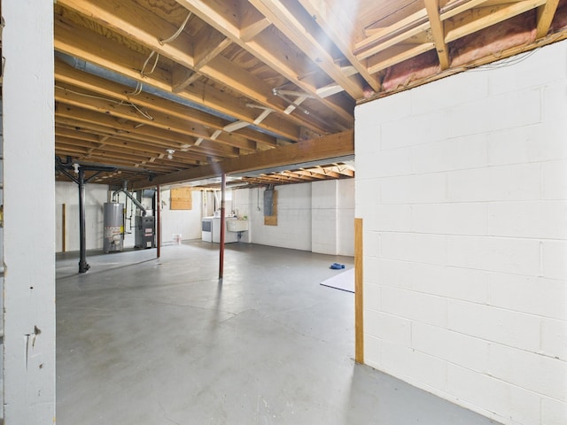 6343 Birchview Dr S Unit 6343-6345, Reynoldsburg, OH 43068 - unfinished basement with water heater, concrete block wall, and washer / clothes dryer