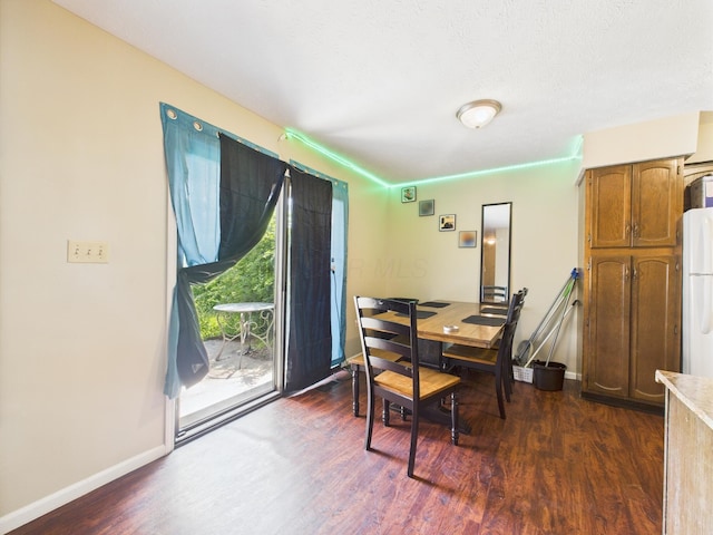 6343 Birchview Dr S Unit 6343-6345, Reynoldsburg, OH 43068 - dining area featuring dark wood-style floors and baseboards