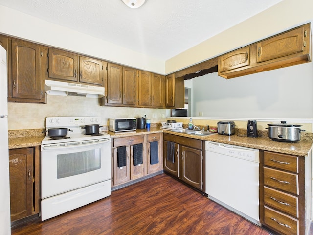 6343 Birchview Dr S Unit 6343-6345, Reynoldsburg, OH 43068 - kitchen with white appliances, under cabinet range hood, light countertops, and dark wood finished floors