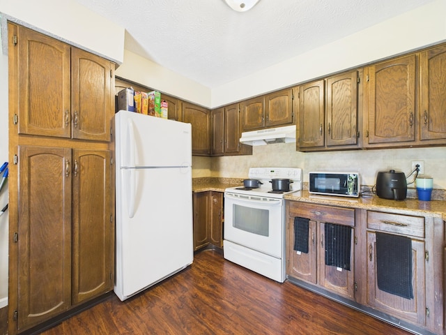 6343 Birchview Dr S Unit 6343-6345, Reynoldsburg, OH 43068 - kitchen featuring white appliances, under cabinet range hood, dark wood-type flooring, and light countertops