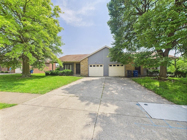6343 Birchview Dr S Unit 6343-6345, Reynoldsburg, OH 43068 - view of front of home featuring a garage, a front yard, concrete driveway, and brick siding