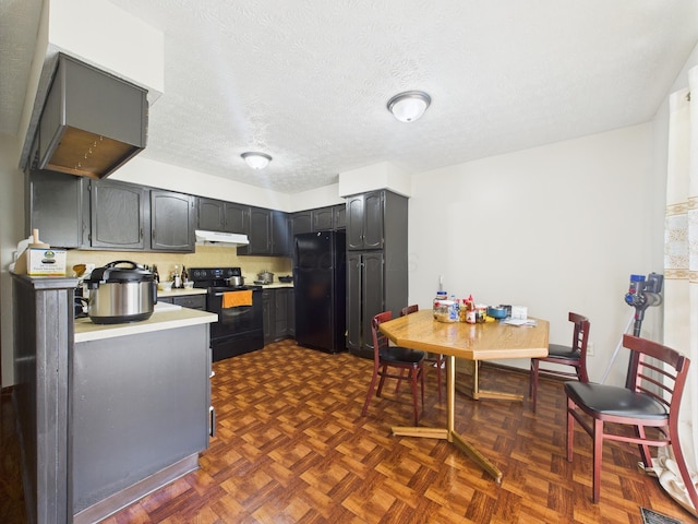6343 Birchview Dr S Unit 6343-6345, Reynoldsburg, OH 43068 - kitchen featuring black appliances, under cabinet range hood, light countertops, and a textured ceiling