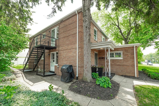 1608 Arlington Ave, Marble Cliff, OH 43212 - rear view of house featuring brick siding, a patio, a wooden deck, and stairs
