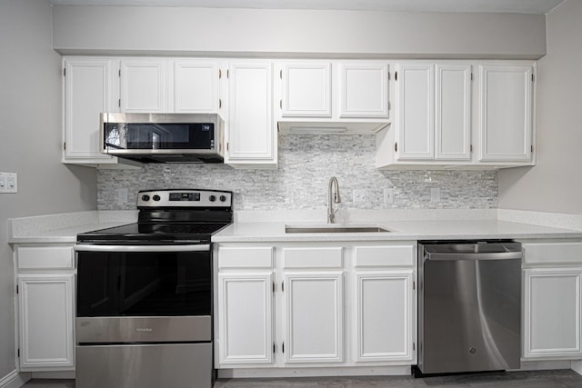 1608 Arlington Ave, Marble Cliff, OH 43212 - kitchen with appliances with stainless steel finishes, white cabinets, light countertops, and tasteful backsplash