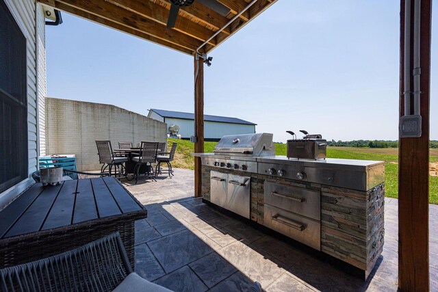 1526 Crosley Rd, Granville, OH 43023 - view of patio / terrace featuring an outdoor kitchen, outdoor dining area, and ceiling fan