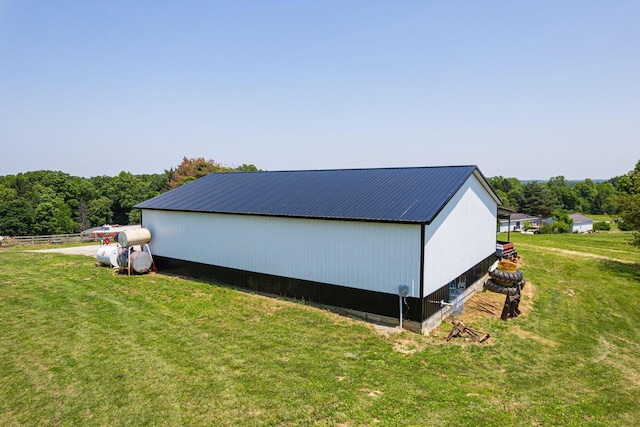 1526 Crosley Rd, Granville, OH 43023 - view of side of home with a pole building, a yard, a metal roof, and an outbuilding