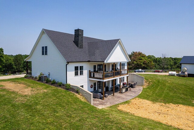 1526 Crosley Rd, Granville, OH 43023 - back of property featuring a patio area, a chimney, a lawn, and roof with shingles