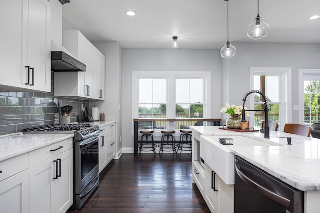 1526 Crosley Rd, Granville, OH 43023 - kitchen featuring stainless steel range with gas stovetop, dishwasher, wall chimney exhaust hood, decorative backsplash, and dark wood-type flooring