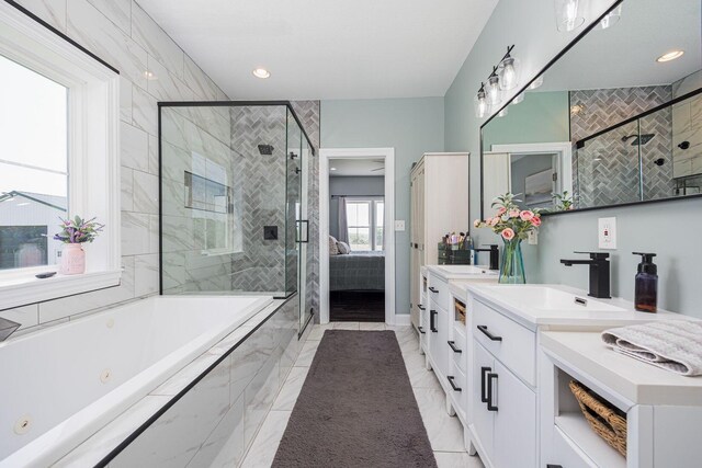 1526 Crosley Rd, Granville, OH 43023 - bathroom featuring a tub with jets, double vanity, a shower stall, marble finish flooring, and recessed lighting