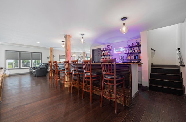 1526 Crosley Rd, Granville, OH 43023 - indoor dry bar featuring ornate columns, wood finished floors, stairway, and recessed lighting