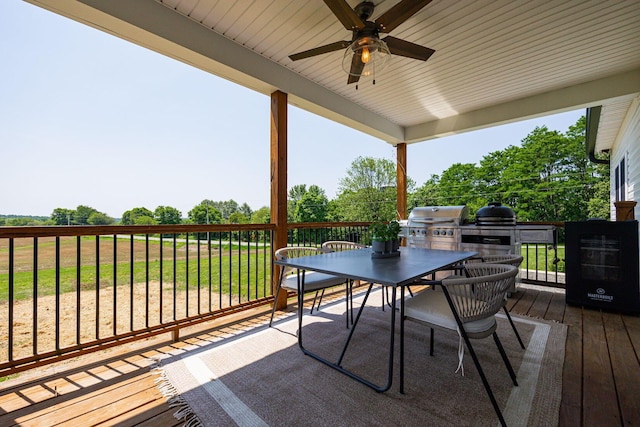 1526 Crosley Rd, Granville, OH 43023 - wooden terrace with outdoor dining area, a ceiling fan, a lawn, and area for grilling