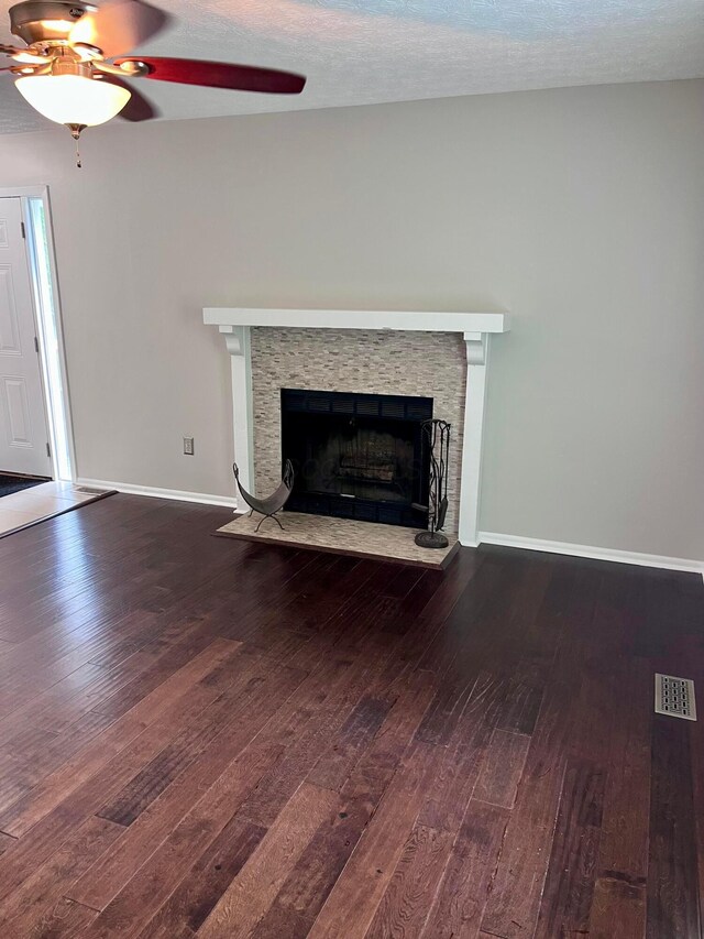 347 W 5th Ave, Columbus, OH 43201 - unfurnished living room featuring ceiling fan, a fireplace, and hardwood / wood-style floors