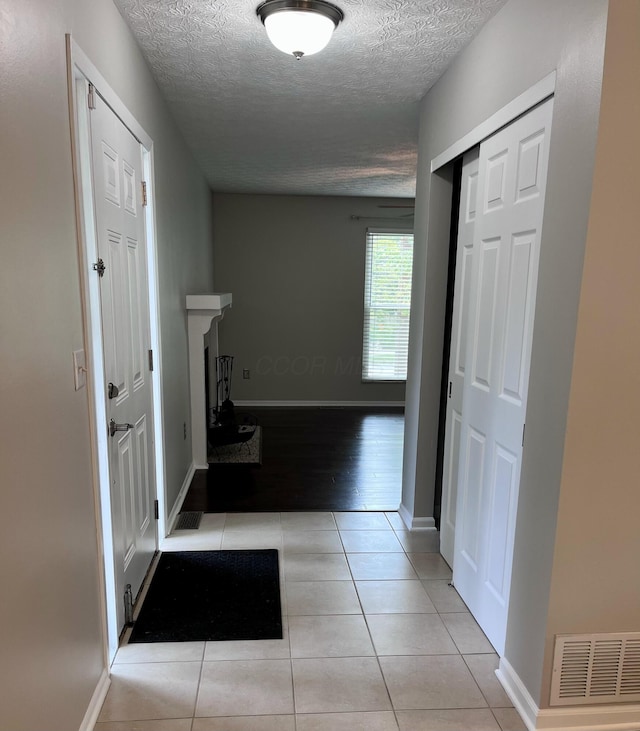 347 W 5th Ave, Columbus, OH 43201 - hall with a textured ceiling and tile patterned flooring