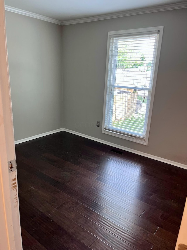 347 W 5th Ave, Columbus, OH 43201 - spare room featuring dark wood-type flooring and crown molding