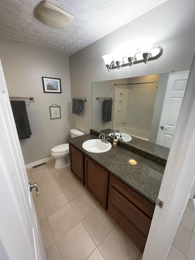 347 W 5th Ave, Columbus, OH 43201 - bathroom with vanity, tile patterned flooring, a shower, and a textured ceiling