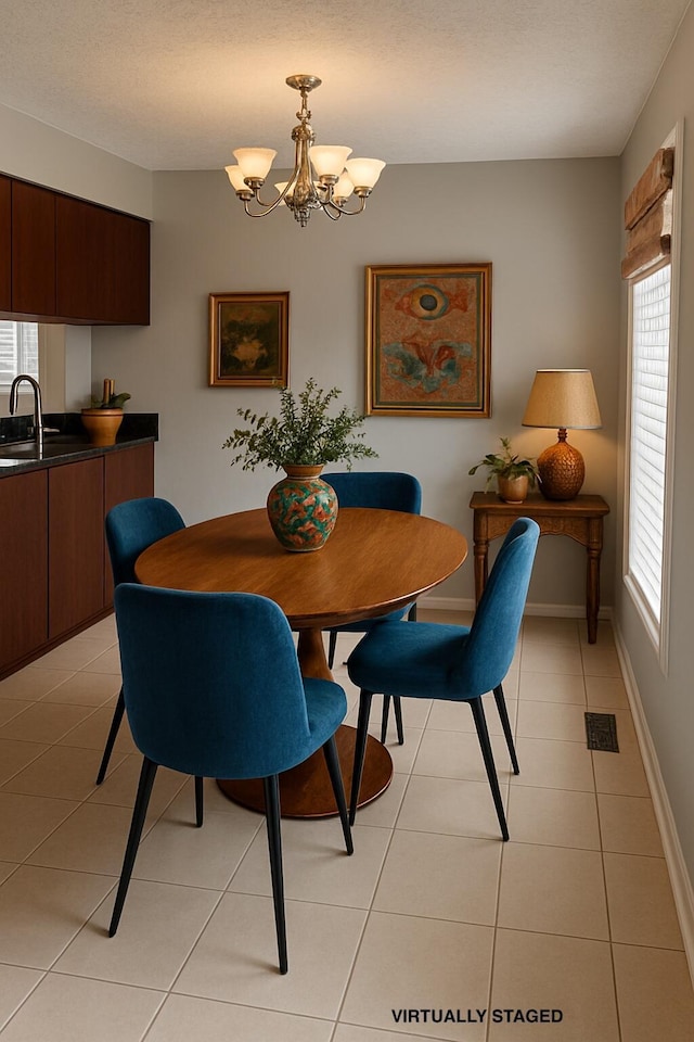 347 W 5th Ave, Columbus, OH 43201 - dining room featuring plenty of natural light, light tile patterned flooring, and a chandelier