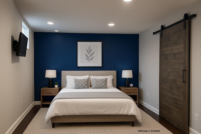 347 W 5th Ave, Columbus, OH 43201 - bedroom featuring a barn door, dark wood finished floors, and recessed lighting