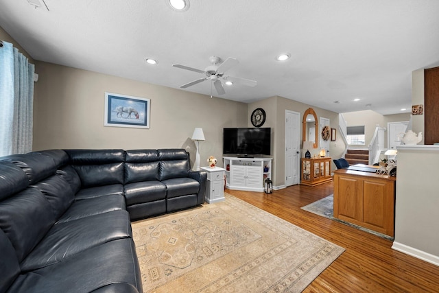 8438 Diversey Loop Unit 504, Blacklick, OH 43004 - living area with stairway, wood finished floors, ceiling fan, recessed lighting, and arched walkways