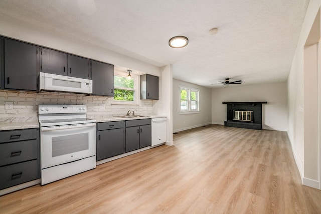5350 Bittersweet Ct, Columbus, OH 43230 - kitchen featuring white appliances, backsplash, light wood finished floors, light countertops, and ceiling fan