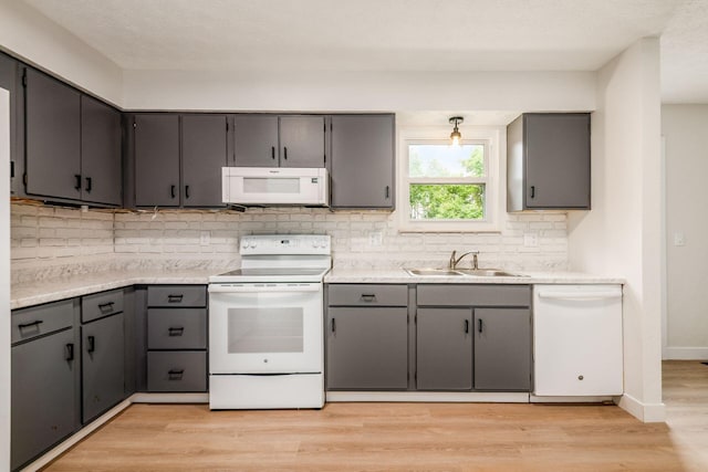 5350 Bittersweet Ct, Columbus, OH 43230 - kitchen with white appliances, tasteful backsplash, light wood-style floors, and gray cabinetry