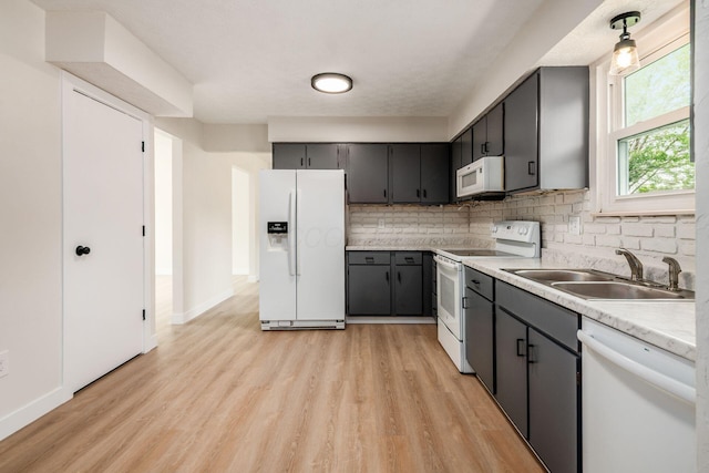 5350 Bittersweet Ct, Columbus, OH 43230 - kitchen with white appliances, light wood-type flooring, backsplash, light countertops, and gray cabinets