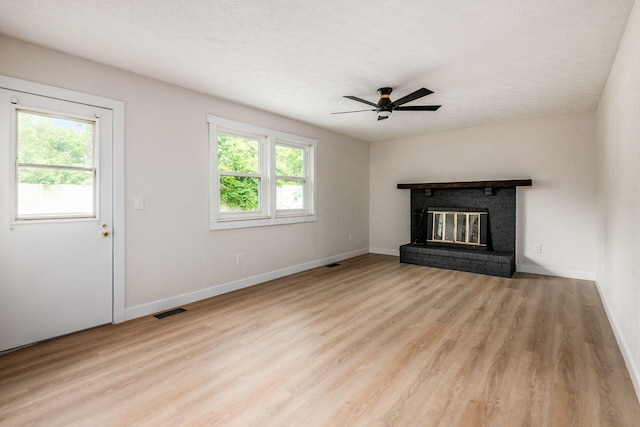 5350 Bittersweet Ct, Columbus, OH 43230 - unfurnished living room with a ceiling fan, wood finished floors, and a brick fireplace