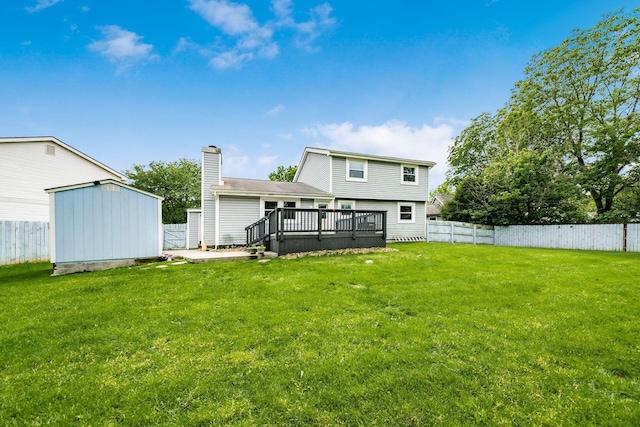 5350 Bittersweet Ct, Columbus, OH 43230 - back of property with a fenced backyard, a wooden deck, a storage shed, and a chimney