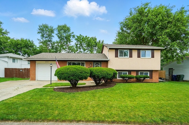 4860 Downing Dr, Columbus, OH 43232 - tri-level home with brick siding, driveway, and a garage