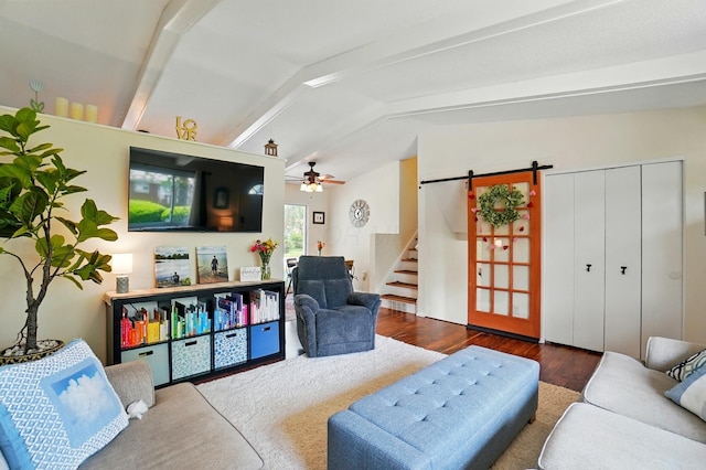 4860 Downing Dr, Columbus, OH 43232 - living room with a barn door, wood finished floors, a ceiling fan, and stairway