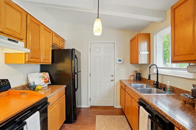 4860 Downing Dr, Columbus, OH 43232 - kitchen with black appliances, under cabinet range hood, light tile patterned flooring, hanging light fixtures, and brown cabinetry