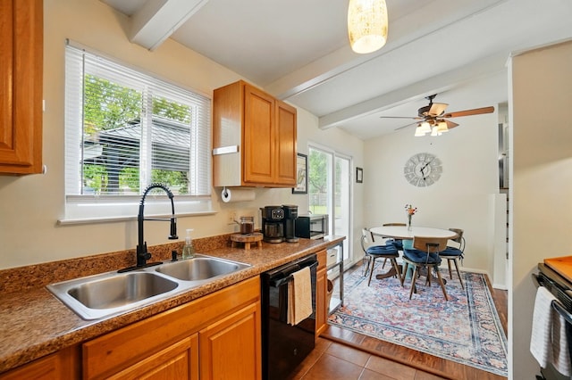4860 Downing Dr, Columbus, OH 43232 - kitchen featuring black dishwasher, stainless steel microwave, tile patterned floors, and brown cabinetry