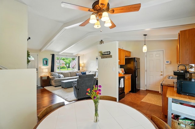 4860 Downing Dr, Columbus, OH 43232 - dining area with ceiling fan, lofted ceiling, and dark tile patterned floors