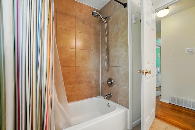 4860 Downing Dr, Columbus, OH 43232 - full bathroom featuring shower / bath combo with shower curtain and baseboards