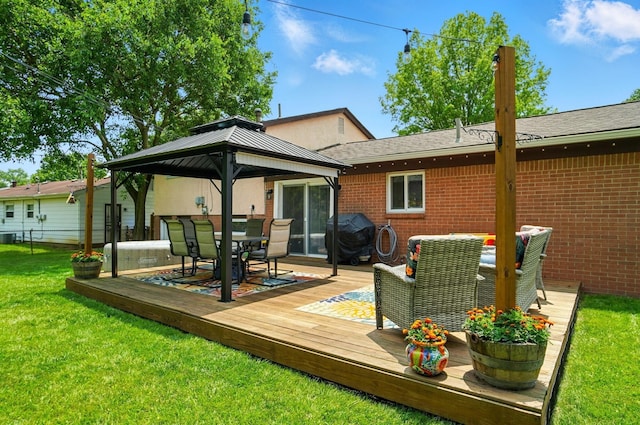 4860 Downing Dr, Columbus, OH 43232 - rear view of house featuring outdoor dining area, a wooden deck, a gazebo, and brick siding