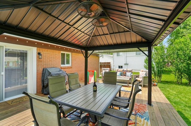 4860 Downing Dr, Columbus, OH 43232 - deck featuring a gazebo, a ceiling fan, outdoor dining space, an outdoor living space, and area for grilling