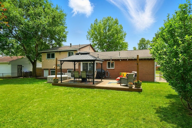 4860 Downing Dr, Columbus, OH 43232 - rear view of property featuring a gazebo, brick siding, a deck, and outdoor lounge area