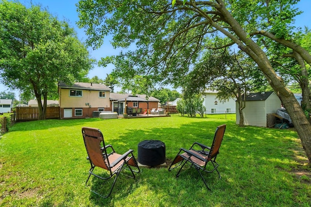 4860 Downing Dr, Columbus, OH 43232 - fenced backyard with a fire pit