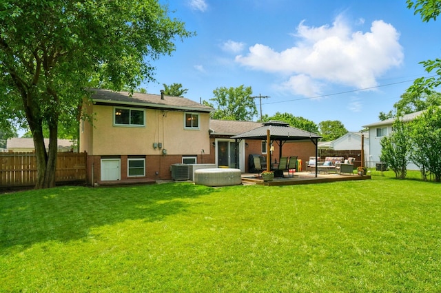 4860 Downing Dr, Columbus, OH 43232 - back of property featuring outdoor lounge area, a gazebo, stucco siding, and a patio