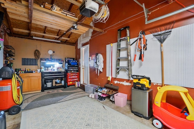 4860 Downing Dr, Columbus, OH 43232 - garage with a garage door opener and a workshop area