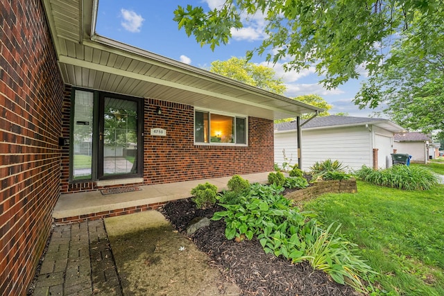 4750 Manitoba Ct, Columbus, OH 43229 - entrance to property with brick siding and a lawn