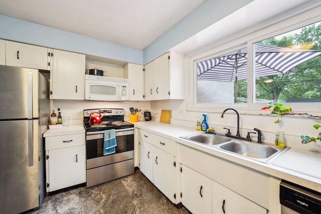 4750 Manitoba Ct, Columbus, OH 43229 - kitchen with stainless steel appliances, white cabinets, light countertops, and open shelves