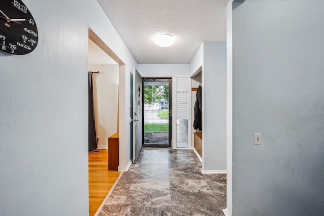 4750 Manitoba Ct, Columbus, OH 43229 - entryway with baseboards and a textured ceiling
