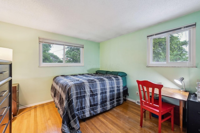4750 Manitoba Ct, Columbus, OH 43229 - bedroom with wood finished floors and multiple windows