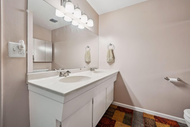 4750 Manitoba Ct, Columbus, OH 43229 - bathroom with toilet and double vanity